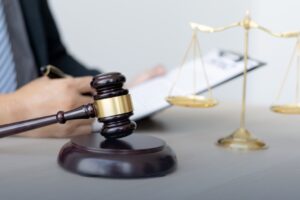 A legal professional reviews documents, symbolizing law and justice.