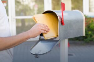 A process server professionally delivering legal documents.