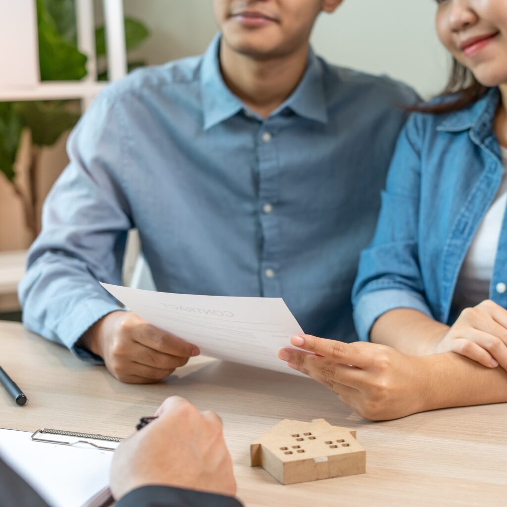 Clients reviewing rental or eviction paperwork with legal expert