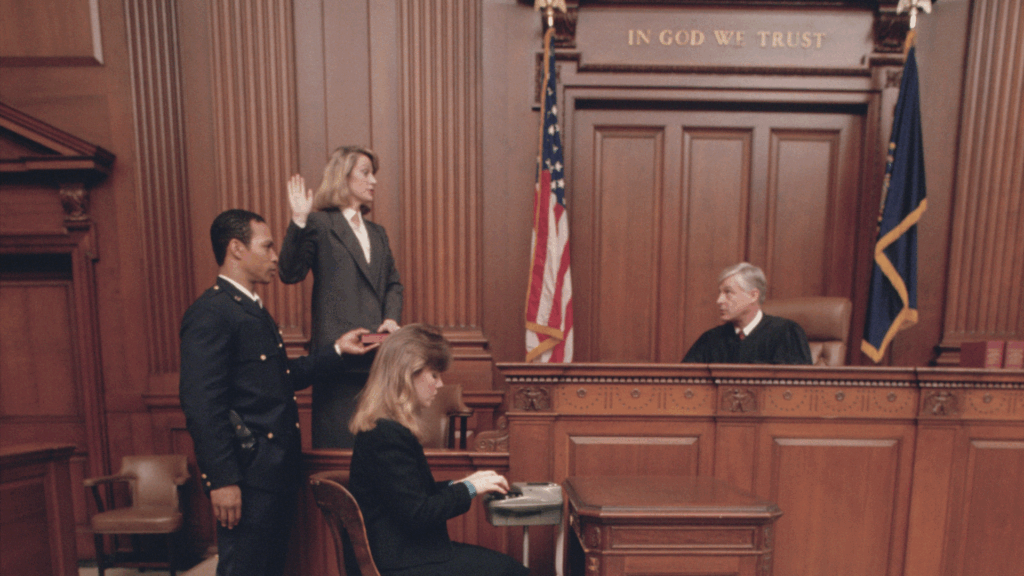 Courtroom scene with stenographer, judge, and witness taking oath